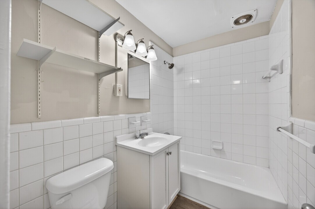 Bathroom with tiled tub and shower